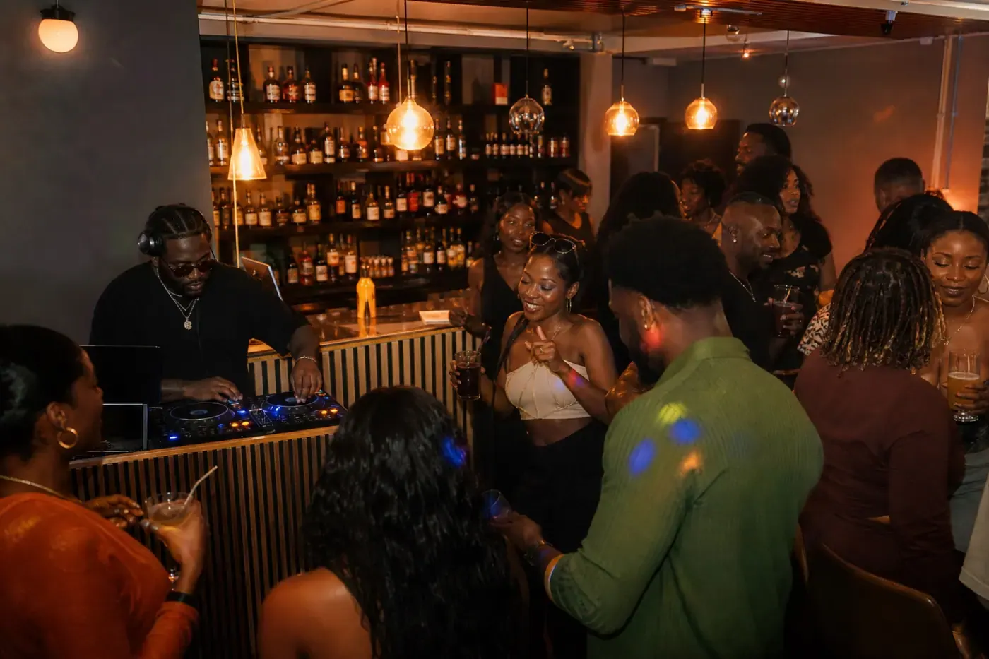 DJ playing to guests during an evening event at 042